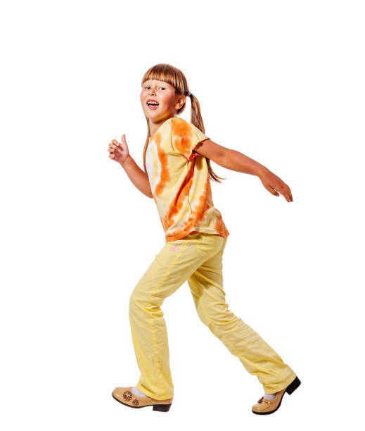 istock Little girl walking 900508792