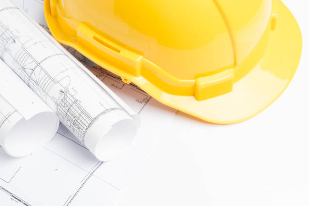 istock office desk with helmet on white background 900509222