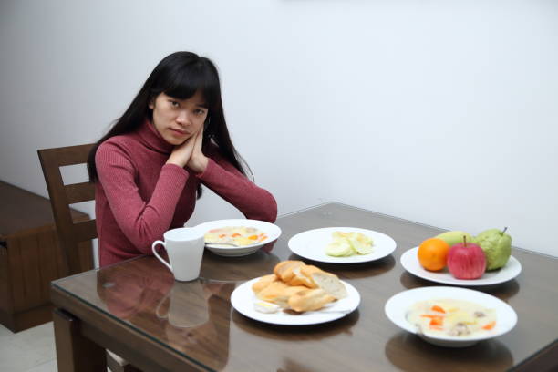 istock The woman eating dinner 900509612