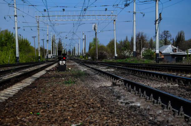 istock Red signal on a semaphore on railroad track 900509684