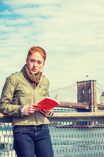 istock Reading Book outside in New York 900517650