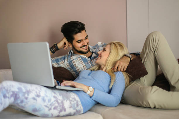 istock Happy young couple at home 900523326
