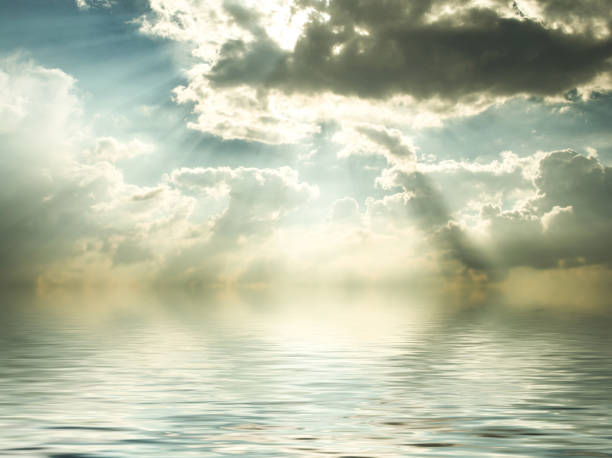 reflection of blue sky with white clouds in water