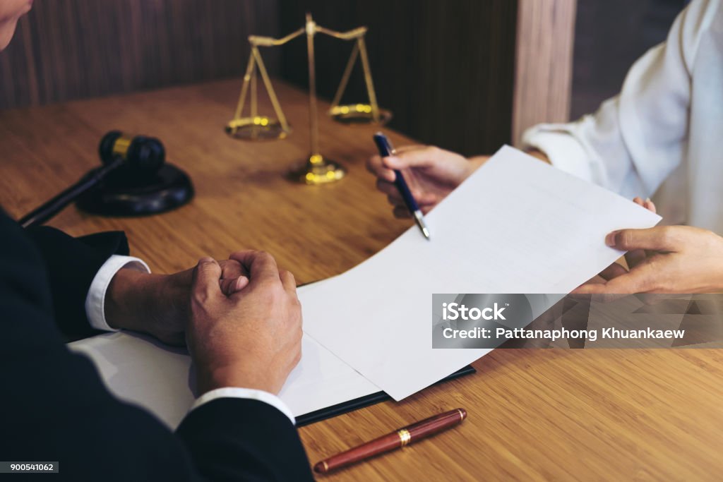 Customer service good cooperation, Consultation between a male lawyer and business people customer, tax and the company of real estate concept Customer service good cooperation, Consultation between a male lawyer and business people customer, tax and the company of real estate concept. Law Stock Photo