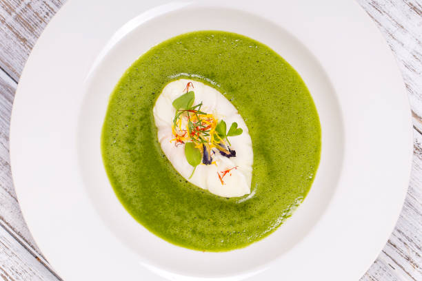 istock Poached egg, green healthy soup, close up in white plate 900546928