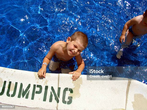 Kids Swimming In A Pool Stock Photo - Download Image Now - Baby - Human Age, Blue, Boys
