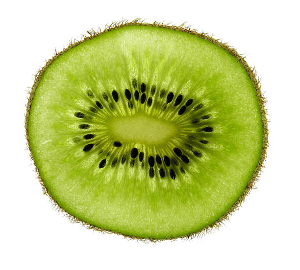 tranche de kiwi - textured nobody close up seed photos et images de collection