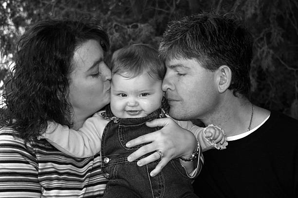 istock kisses from mommy and daddy 90056063