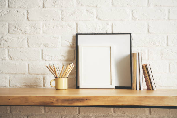 istock Desk with picture frame and supplies 900566184