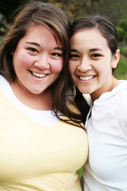 istock Two Sisters Posing for a Photo 90057025