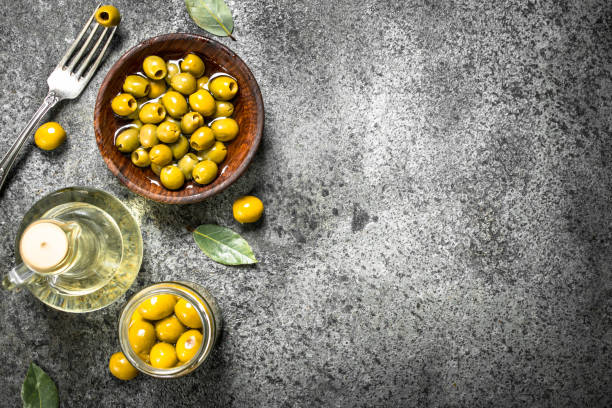 istock Pickled olives with olive oil. 900572518