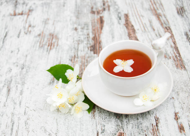 istock Cup of tea with jasmine flowers 900575682
