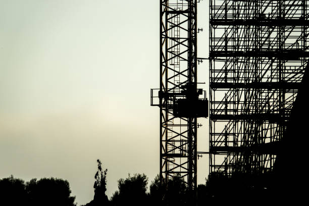 istock silhouette of scaffolding construction building 900580468