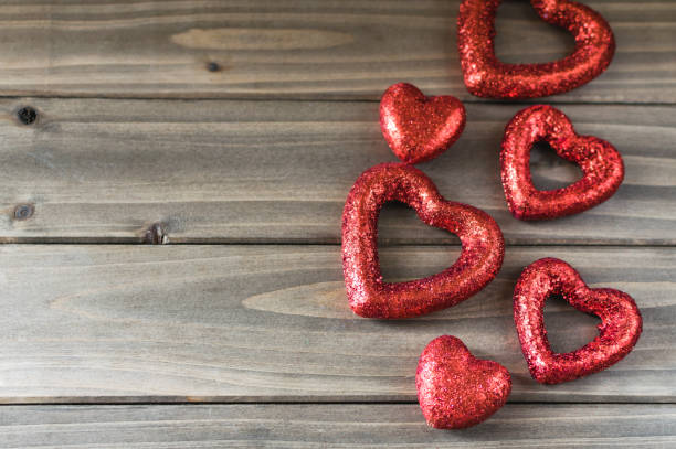 istock Valentine's day holiday red glitter background with blur. 900584110
