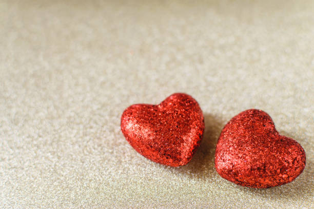 istock Valentine's day holiday red glitter background with blur. 900584112