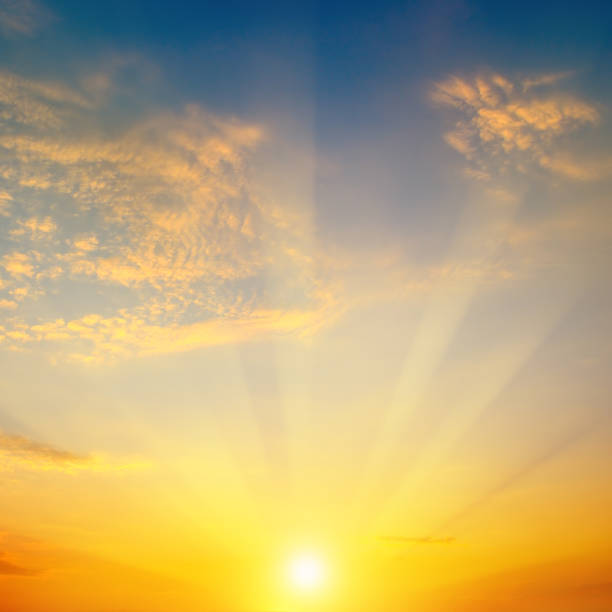 istock Cloudy sky and bright sunrise over the horizon. 900586794