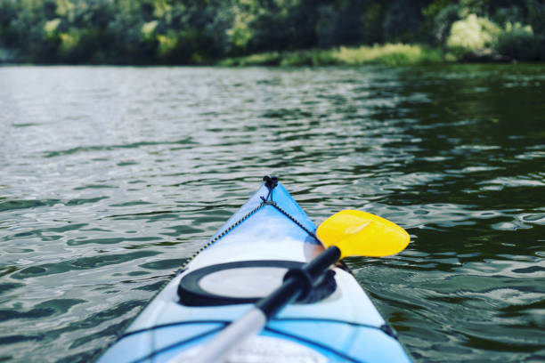 Boating on a kayak. Camping on the river bank.