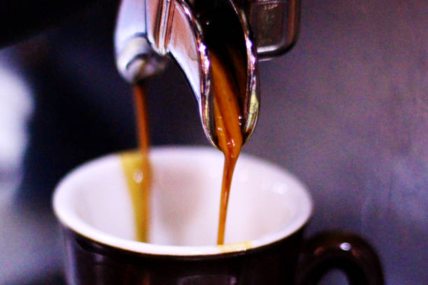 istock Close-up of espresso pouring from coffee machine 900588842