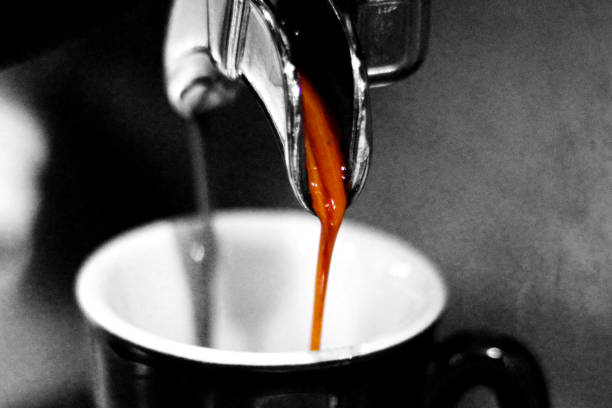 Close-up of espresso pouring from coffee machine