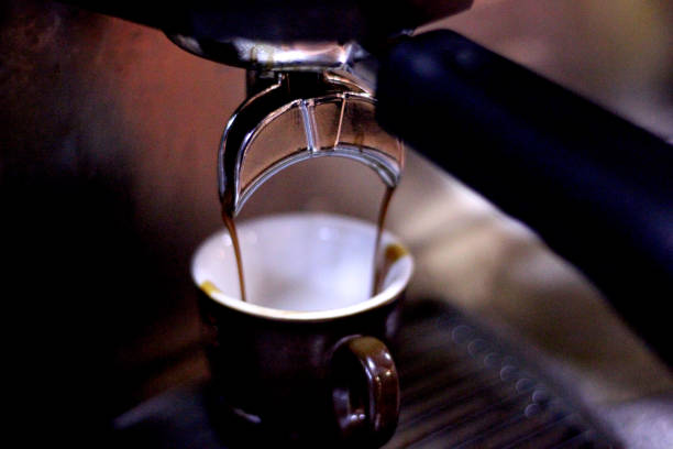 Close-up of espresso pouring from coffee machine