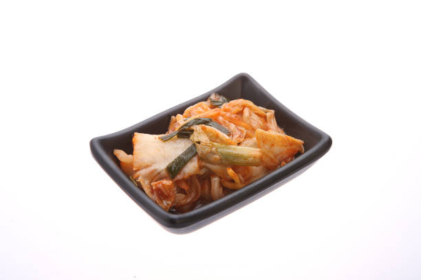 Small dish of kimchi on white background