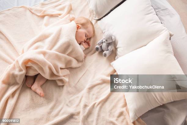 Sweet Child Dreaming With Thumb In Mouth Stock Photo - Download Image Now - Baby - Human Age, Sheet - Bedding, Wrapping