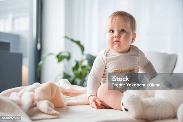 Calm Child Resting On Bed Stock Photo - Download Image Now - Voluptuous, Babbler, Bed - Furniture