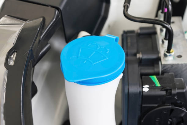 istock Car engine windshield washer fluid reservoir cap close-up 900596848