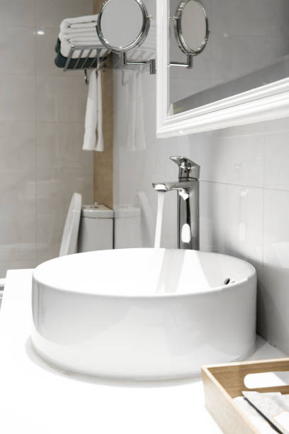 istock Bathroom interior with sink and faucet 900600366