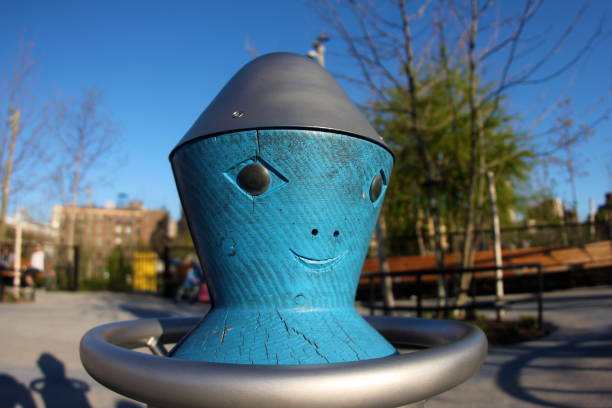 a picture of an alien spin wheel in a playground in Brooklyn new york