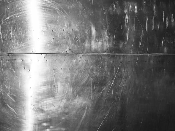 istock Shiny scratched metal surface close up 900607930