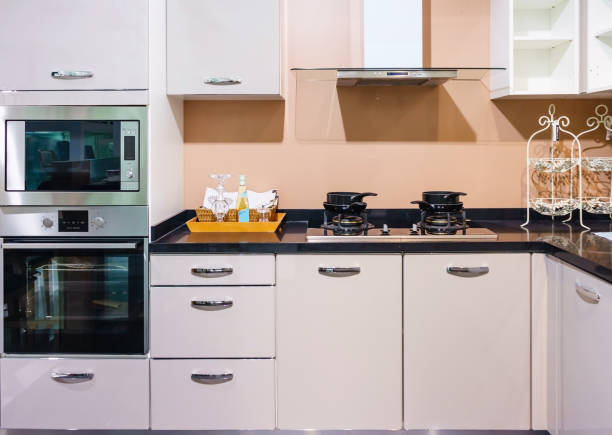 istock Bright modern kitchen with stainless steel appliances. Interior design. 900611178