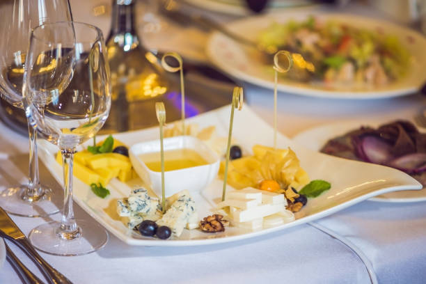 istock Honey and cheeses on a white plate, food 900612360
