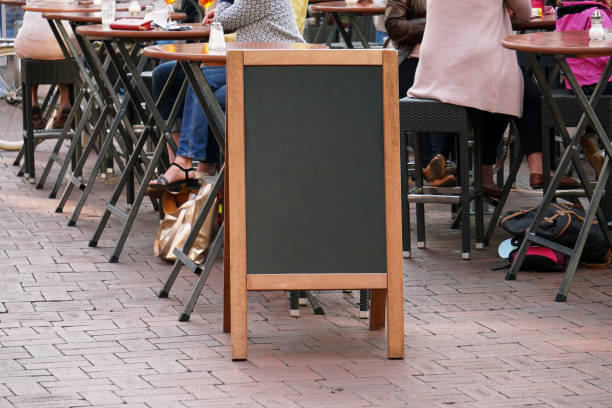 istock blank blackboard advertising sign or customer stopper 900612568