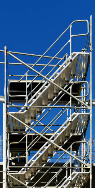 istock Stairs to nothing, steel staircase construction on a building site 900612610