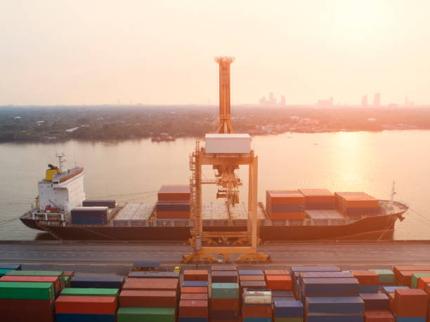 istock container,container ship in import export and business logistic,By crane,Trade Port , Shipping,cargo to harbor.Aerial view,Water transport,International,Shell Marine,transportation,logistic,trade,port 900615200