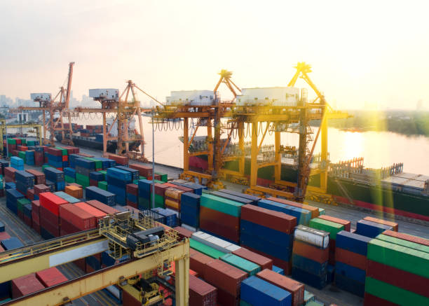 istock container,container ship in import export and business logistic,By crane,Trade Port , Shipping,cargo to harbor.Aerial view,Water transport,International,Shell Marine,transportation,logistic,trade,port 900615236
