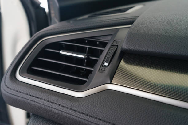 istock Interior of a modern car, Car Air Conditioner and switch on/off compartment. 900615324