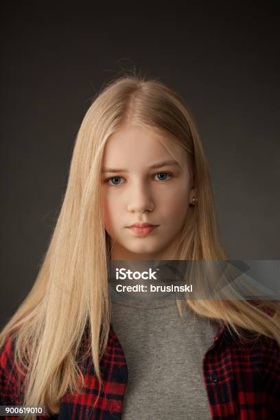 Portrait Of Teenage Girl In Studio On Black Background Stock Photo - Download Image Now