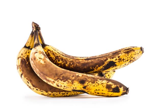 istock Banana. Over ripe bananas isolated on white with shadows 900619726