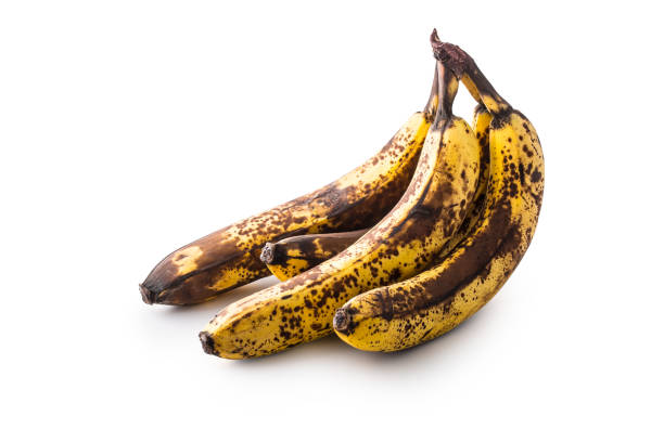 istock Banana. Over ripe bananas isolated on white with shadows 900619730