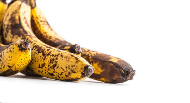 istock Banana. Over ripe bananas isolated on white with shadows 900621338