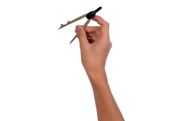 Asian student boy holding mathematics compass circle or compass ellipsis isolated on white background. Close up of student hand with compass circle. Mathematics equipment concept.