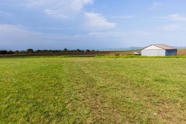 istock Grass Airstrip Aircraft Hangar Farm 900625968