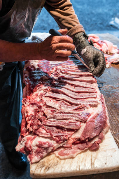 istock Butcher Cutting the Meat 900626152