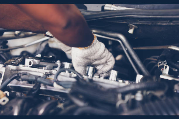 istock Hands of auto mechanic repairing car. Selective focus. 900629068