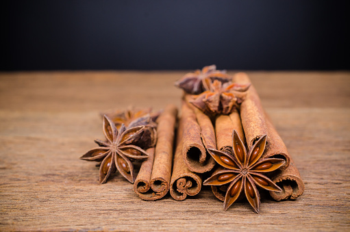 Star anise and cinnamon stick on wooden board background,Chinese star aniseed