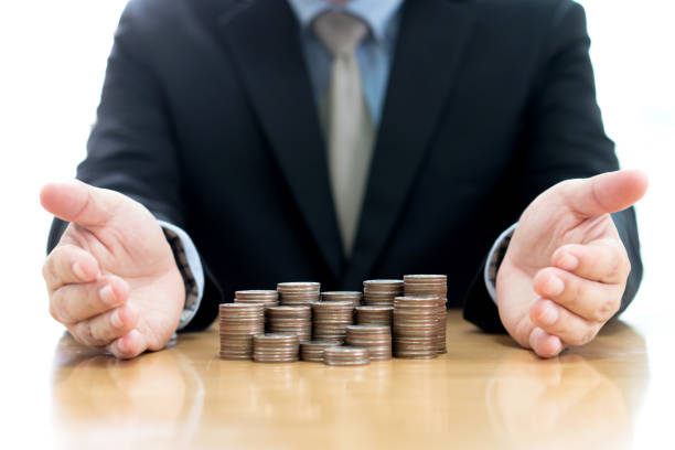 istock Businessman Protect Stack Of Coins 900632650