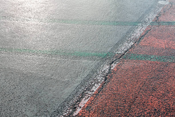 istock Asphalt with painted dividing lines in blue and white color 900635940
