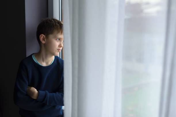 istock Sad alone little boy child 900636598